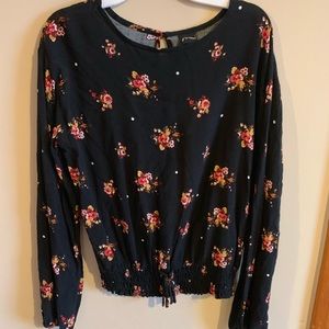 A black long sleeve with multi color flowers